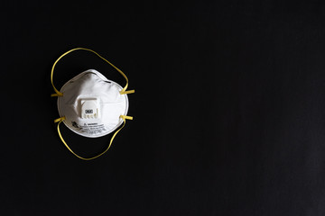 Protective masks on black background. N95 masks on a black background. Medical and construction protective equipment. N95 masks M3