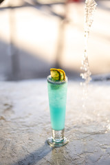 Cocktail Blue Lagoon on concrete background