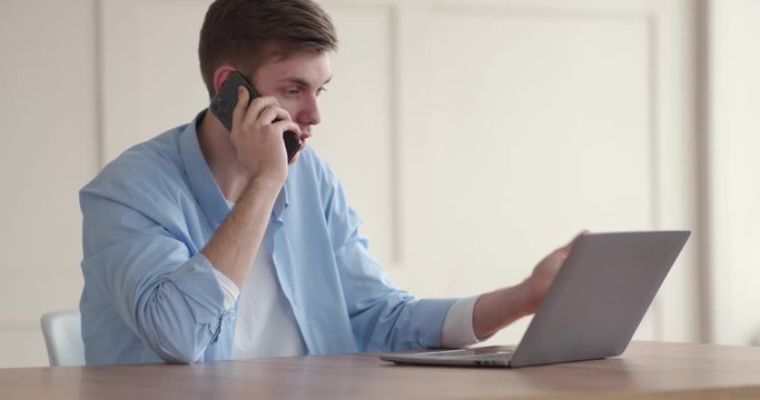 Dissatisfied client explaining computer problem to customer support by phone