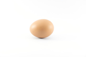 Close up of organic raw brown chicken egg isolated with white background