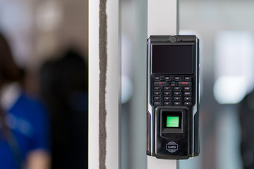 fingerprint scanner on wall to record working time or enter security system