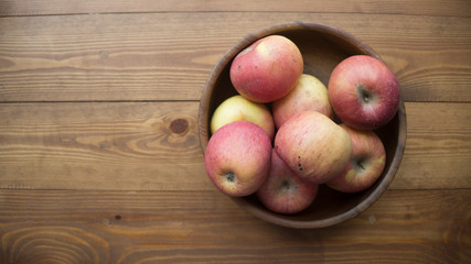 ripe apples on a wooden background
