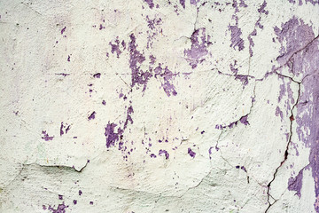 Fototapeta premium Texture of a concrete wall with cracks and scratches which can be used as a background
