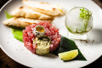 Tuna tartare served on a plate in restaurant