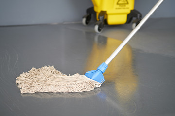 Mop and bucket, janitorial service.