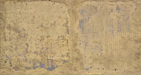 Yellow plastered wall. Texture with plaster stains