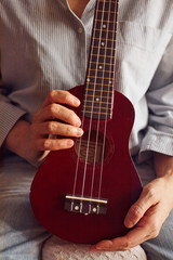 Fototapeta na wymiar close up of a woman playing guitar