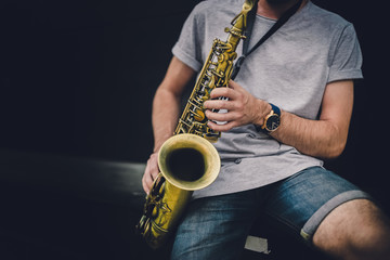 Musician playing alto saxophone on a gig.