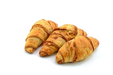 Three cinnamon croissants on white background. Sweet rolls. Mini Desserts with cinnamon.