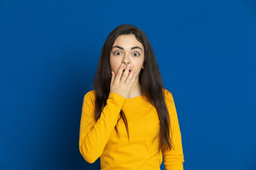 Brunette young girl wearing yellow jersey