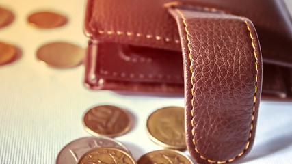 an empty wallet and some coins scattered next to it. economic crisis . concept of small salaries. Russian rubles .