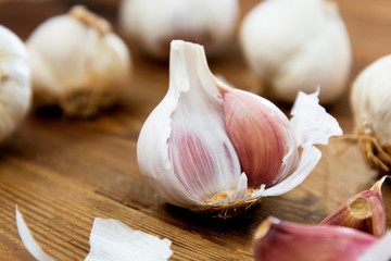 Close up whole garlic on wooden background. Cooking ingredient.