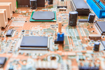 Close up of electronic component on modern PC computer mainboard. Printed Circuit Board with...
