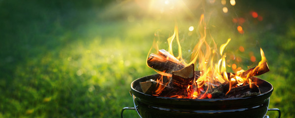 Barbecue Grill with Fire on Open Air. Fire flame - obrazy, fototapety, plakaty