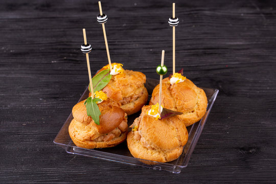 Canape with a pate of chicken, beef and duck, served in ecklers with greens

