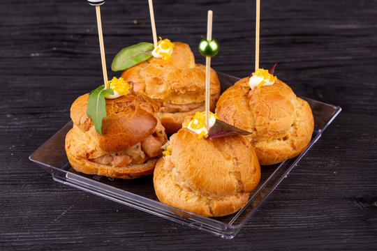 Canape with a pate of chicken, beef and duck, served in ecklers with greens
