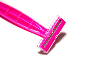 Pink razor isolated close up