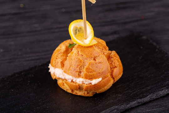 Canape with a pate of chicken, beef and duck, served in ecklers with greens
