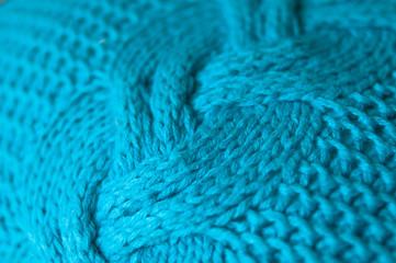 .knitted pillows handmade at home in bed .needles ,purl and facial knitting,soft and warm material