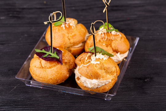 Canape with a pate of chicken, beef and duck, served in ecklers with greens
