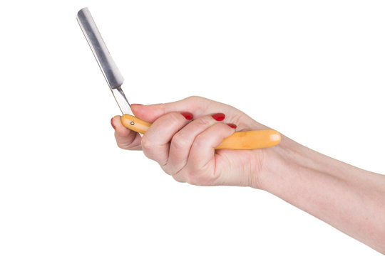 Female hand holding Vintage straight razor