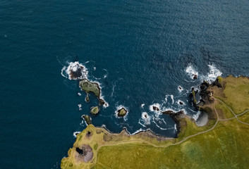 Amazing aerial seascape from above, Gatklettur basalt rock arch at the volcanic cliff, Atlantic...