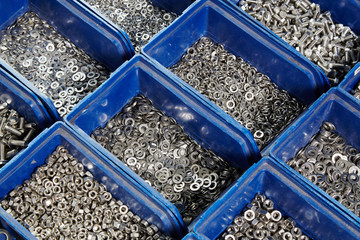 Nuts, bolts and screws in boxes