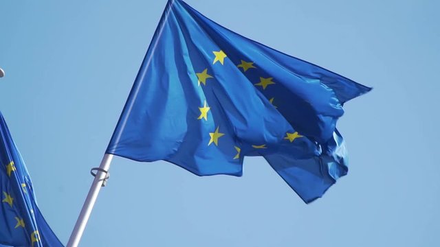 Brussels, Belgium - 04/11/2019 European Union flags wave in the wind in front of the European Commission. European cartier. Full HD, 1080p 100fps