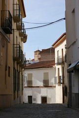 Fototapeta na wymiar narrow cosy street in the old medieval town of Guadix, Spain