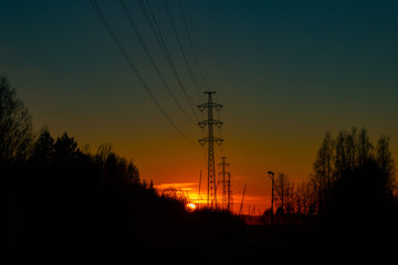 High voltage towers aganist the beautiful sunset