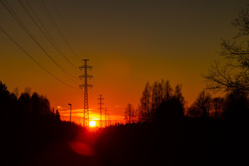 High voltage towers aganist the beautiful sunset