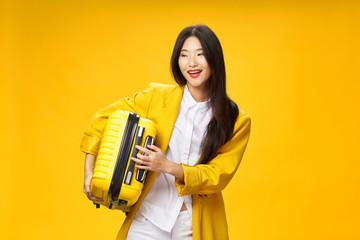 young woman holding a yellow folder