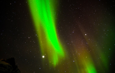 Fototapeta na wymiar Northern lights in the skies of Norway