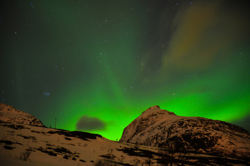 Fototapeta na wymiar Northern lights in the skies of Norway