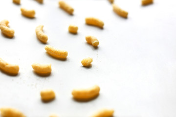Fototapeta na wymiar Sweet corn sticks on white background unorganized close up front view