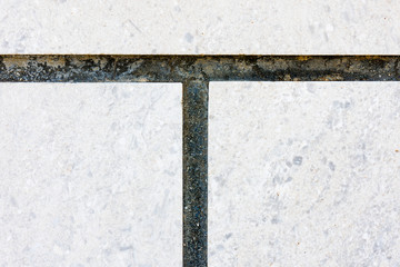 Fototapeta premium Grout between concrete floor tiles.