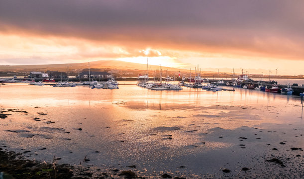 Kirkwall, Orkney, Scotland / United Kingdom - August 31, 2014: Sunset over the harbor