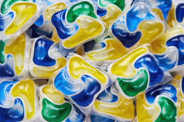 Colorful dishwasher tablets background
