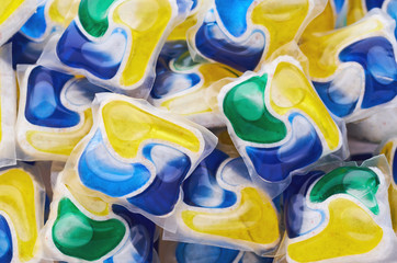 Colorful dishwasher tablets background
