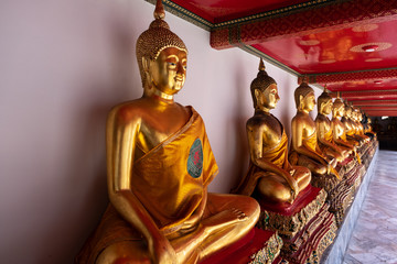 Buddha statues or sculptings in Wat Pho Temple, a lot of Buddha statues next to each other