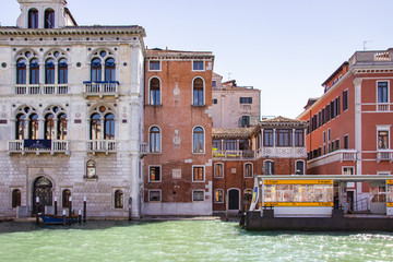 Water channels of Venice city. Facades of residential buildings overlooking the Grand Canal in...