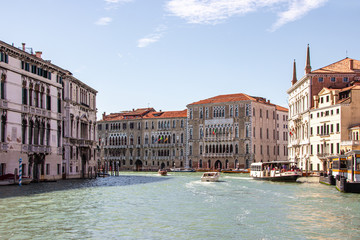 Obraz premium Water channels of Venice city. Facades of residential buildings overlooking the Grand Canal in Venice, Italy.