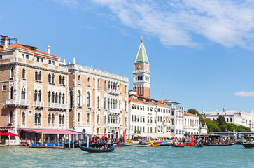 Fototapeta na wymiar Water channels of Venice city. Facades of residential buildings overlooking the Grand Canal in Venice, Italy.