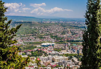 Fototapeta premium Panoramic view of Tbilisi city from Mt Mtatsminda, old town and modern architecture. Georgia