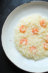 risotto shrimp prawn seafood rice Menu concept. food background. top view copy space for text keto or paleo diets