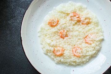 risotto shrimp prawn seafood rice Menu concept. food background. top view copy space for text keto or paleo diets
