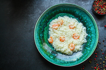risotto shrimp prawn seafood rice Menu concept. food background. top view copy space for text keto or paleo diets