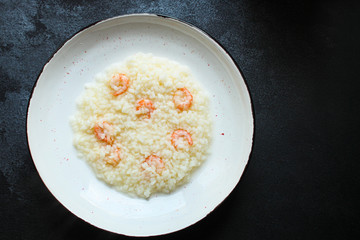 risotto shrimp prawn seafood rice Menu concept. food background. top view copy space for text keto or paleo diets