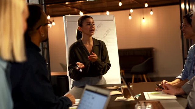 Young businesswoman
laughing during an
presentation in an office