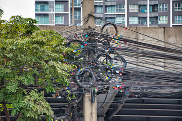 Chaos or order of cables and wires on an electric pole